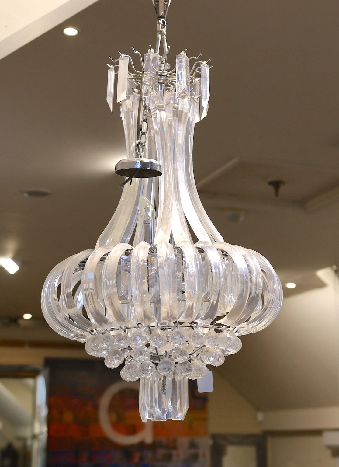 A pair of contemporary perspex chandeliers